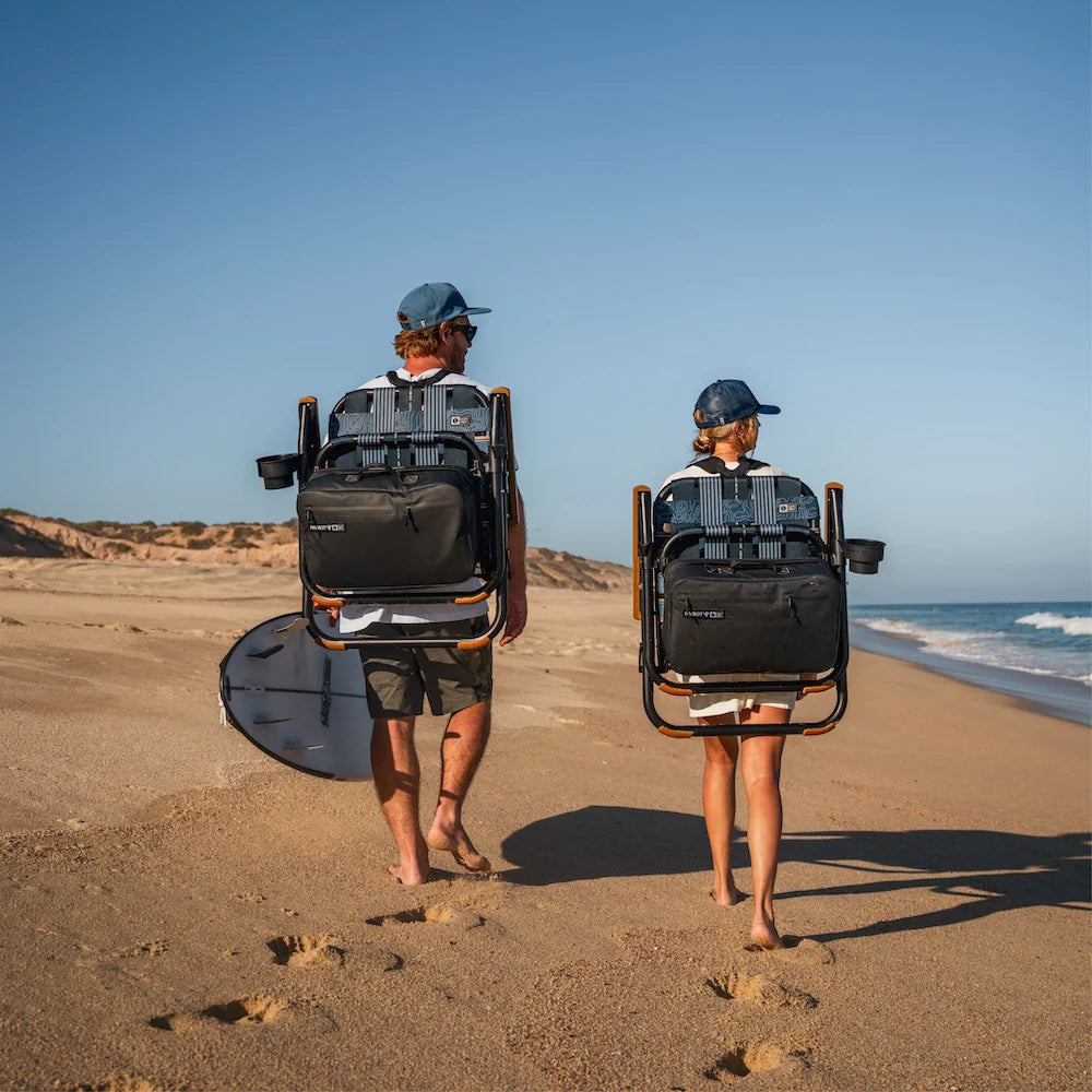 PARKIT x Salty Crew Voyager Chair in limited-edition topo-map pattern, featuring woven webbing, black steel frame, wooden armrests, built-in cooler, cup holder, and backpack straps, rugged 3-in-1 outdoor chair built for surf, fish, and adventure.